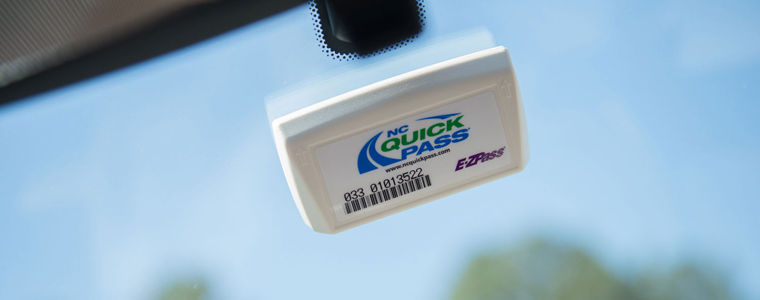 Close up of NC Quick Pass transponder on windshield